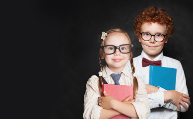 Happy children student in school uniform on black background