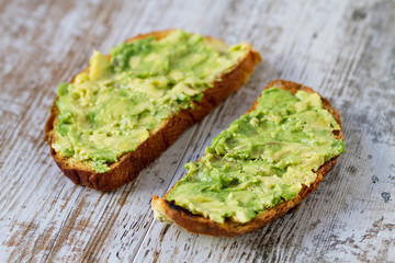 Mashed avocada and whole grain bread healthy toastes