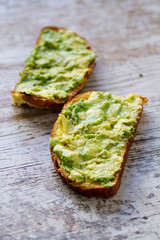 Mashed avocada and whole grain bread healthy toastes