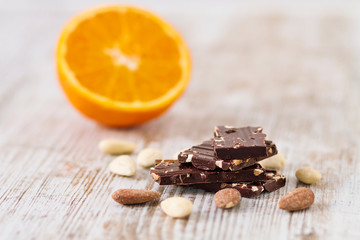 Pieces of dark chocolate with almonds and fruits