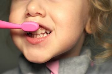 Close up of unhealthy baby teeth. Dental medicine and healthcare - kid open mouth showing caries teeth decay, bad teeth, brushing teeth.
