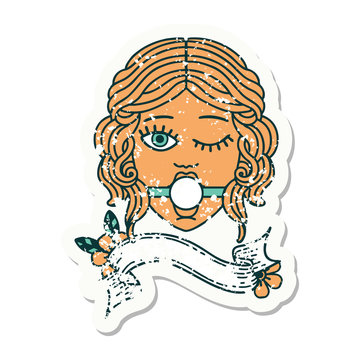 grunge sticker with banner of winking female face with ball gag
