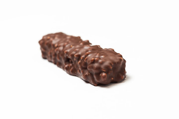 chocolate bar with dark brown chocolate with nuts on a white background.