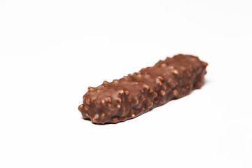 chocolate bar with dark brown chocolate with nuts on a white background.