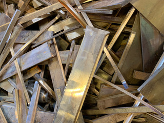 Honey brass scrap ready to be recycled, landscape view 