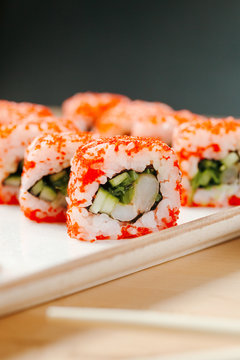 Sushi set roll california shrimp. Delivery food on qurantine. Rice, nori, tiger prawn, cucumber, avocado, spice sauce, masago caviar.