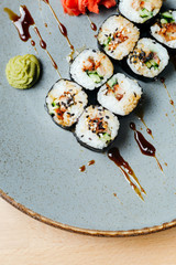 Sushi roll set poppies with eel. Rice, nori, eel, unagi, sesame. Japanese food. Delivery on quarantine.