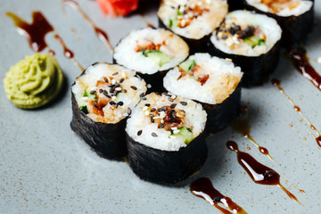 Sushi roll set poppies with eel. Rice, nori, eel, unagi, sesame. Japanese food. Delivery on quarantine.