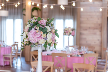 Wedding decor at the banquet. Wedding restaurant decorated with flowers. Luxury wedding table...