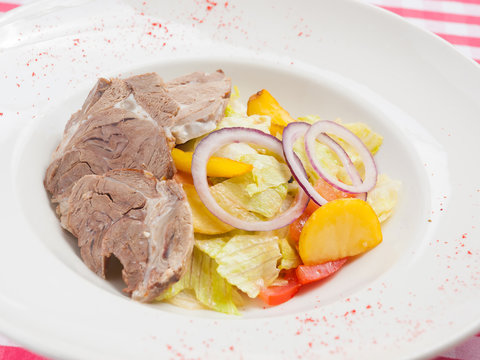 Salad With Lamb And Vegetables: Potatoes Onions Tomatoes. Traditional Cuisine Of Montenegro