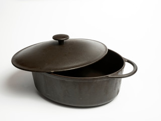 Cast iron pot for stewing, baking with open lid. White isolate