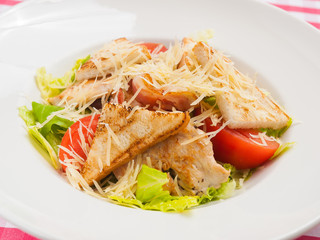 classic Caesar salad on a white plate