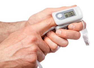Person using pulse oximeter to check oxygen saturation tracking coronavirus symptoms at home