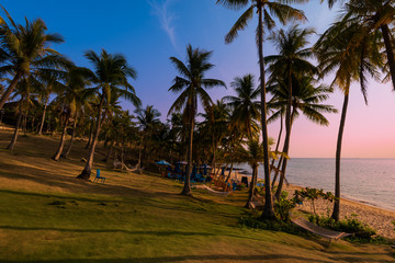 Beautiful beach with palms at sunset in Phu Quoc, Vietnam