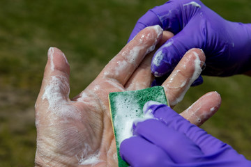 Washing of hand by soap.