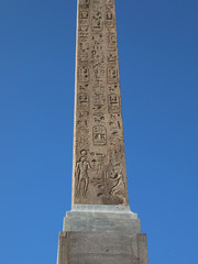 ancient egyptian obelisk with engraved hieroglyphics