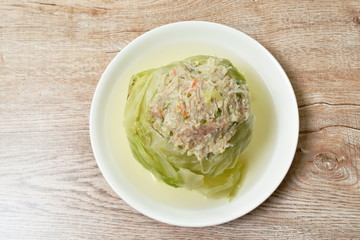 boiled cabbage stuffed minced pork with glass noodles in soup on plate