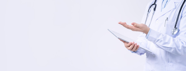 Doctor with stethoscope in white coat holding tablet, showing medical information, diagnosis,...