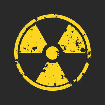 Vector illustration of grunge yellow radioactive hazard warning sign painted over black background.