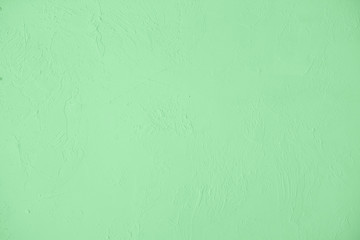 Trendy mint colored low contrast Concrete textured background with roughness and irregularities to your design or product. 2020 color trend concept. Urban modern design. Home decor. 