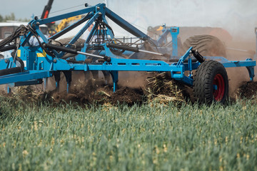 the process of cultivating the soil with the plow during plowing test drive the tractor