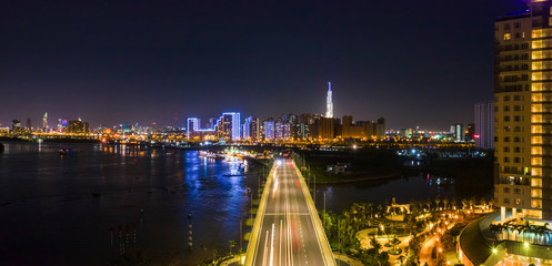 Top view aerial of a Ho Chi Minh City with development buildings, transportation, energy power infrastructure. View from Diamond island, District 2. Sai Gon, Vietnam