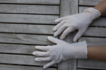 Hands wearing latex gloves for protection