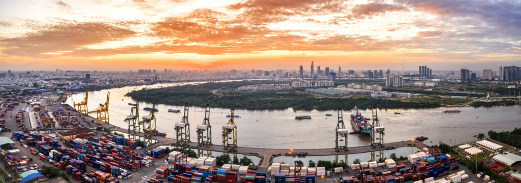 Logistics and transportation of Container Cargo ship and Cargo plane with working crane bridge in shipyard, logistic import export and transport industry background, Ho Chi Minh city, Vietnam