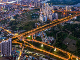 Top view aerial of Mai Chi Tho road and input Long Thanh - Dau Giay expressway with development buildings, transportation, energy power infrastructure. View from District 2