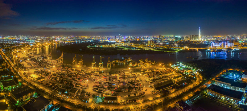 Top view aerial of container harbor in Tan Thuan Export Processing Zone. Center Ho Chi Minh City, Vietnam with development buildings, transportation, energy power infrastructure.