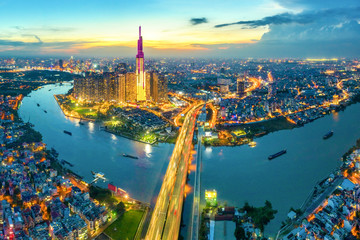 Top view aerial of center Ho Chi Minh City and Saigon bridge with development buildings, transportation, energy power infrastructure. Financial and business centers in  Vietnam. View from District 2