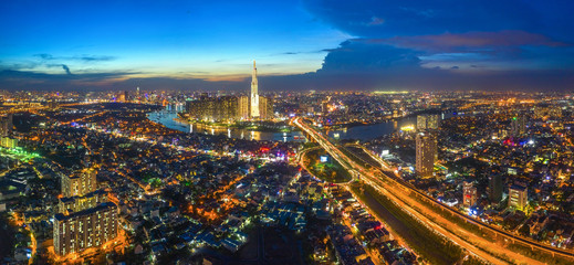 Top view aerial of center Ho Chi Minh City and Saigon bridge with development buildings, transportation, energy power infrastructure. Financial and business centers in  Vietnam. View from District 2