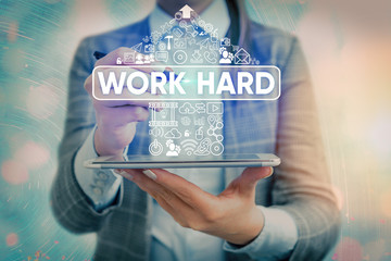 Word writing text Work Hard. Business photo showcasing Laboring that puts effort into doing and...