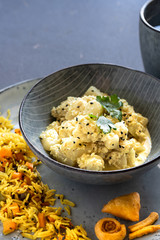 Oriental food - traditional Indian vegetarian dish of Bottle Gourd vegetable or Doodhi called Lauki Sabji. indian cuisine. Indian coconut Curry with ingredients in black background close-up, top view.