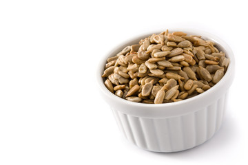 Sunflower seeds in bowl isolated on white background. Copy space	