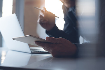 Business man working on laptop in modern office