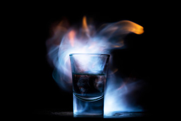 Burning drink in shot glass