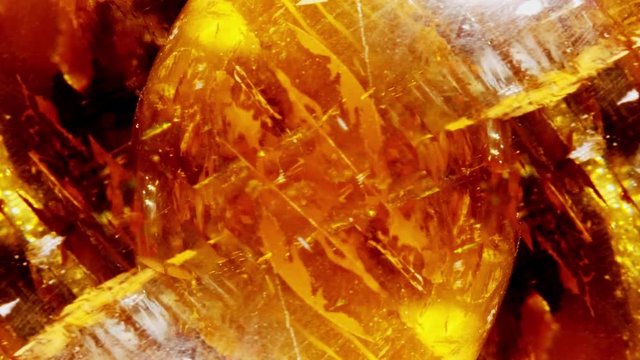 Amber. Beautiful colored pieces of amber. Amber texture. Red-yellow amber with bubbles, waves, divorces and color transitions. Natural mineral Sunstone. Material for jewelers. Crystal.