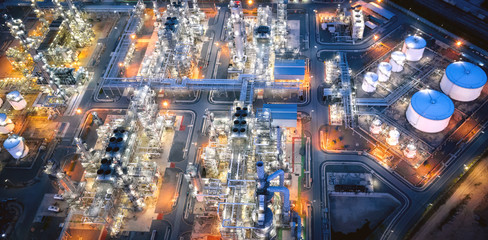 Large oil refinery industrial estates. Fuel refinery industry at night