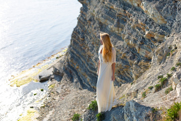 blonde model on the beach at the summer 