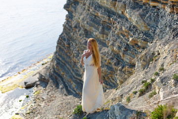 blonde model on the beach at the summer 