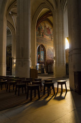 Obraz premium Interior of a church illuminated by the sunlight that inside through one of its large windows