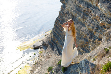 blonde model on the beach at the summer 