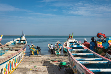 Traditional painted wooden fishing boat in Djiffer, Senegal. West Africa.