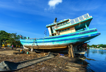 Worker in Shipyard. Shipyard industry ,( ship building) Big ship on floating dry dock in shipyard,...