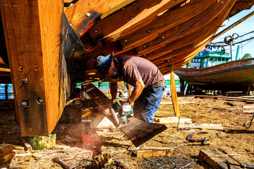 Worker in Shipyard. Shipyard industry ,( ship building) Big ship on floating dry dock in shipyard, Phu Quoc island, Kien Giang, Vietnam