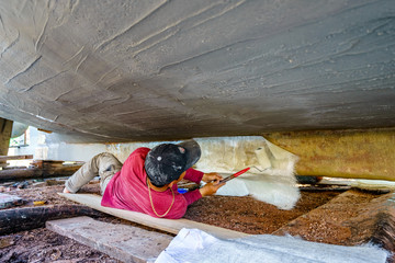 Worker in Shipyard. Shipyard industry ,( ship building) Big ship on floating dry dock in shipyard, Phu Quoc island, Kien Giang, Vietnam