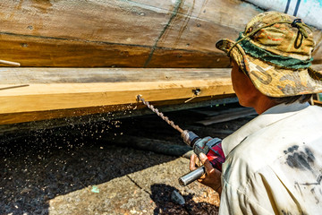Worker in Shipyard. Shipyard industry ,( ship building) Big ship on floating dry dock in shipyard,...