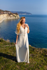 Blonde model at the sea at summer