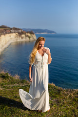 Blonde model at the sea at summer